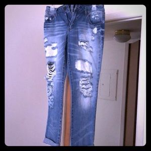 Ankle length distressed jeans. Brand New.
